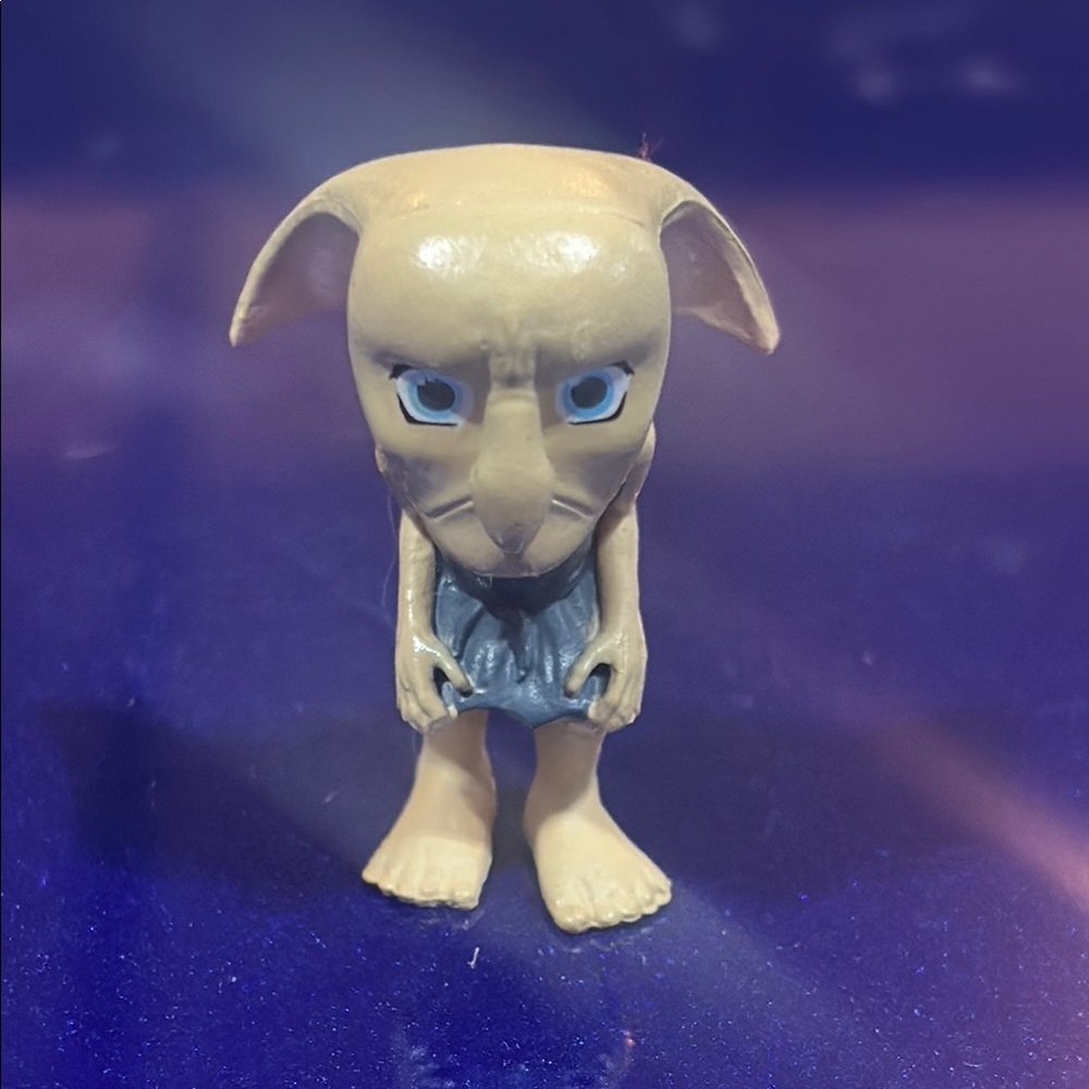Unique Beige Figurine with Blue Accents